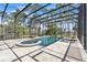 Enclosed pool area featuring a rectangular pool, in-ground hot tub, and lounge chairs for relaxation at 2111 Hontoon Rd, Deland, FL 32720