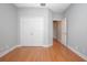 Empty room featuring hardwood floors, closet, and doorway at 215 Coleton Ln, Deland, FL 32724