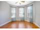 Sunny bedroom with hardwood floors and plenty of natural light from windows at 215 Coleton Ln, Deland, FL 32724