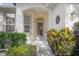 Inviting front entrance with decorative accents and lush plantings at 215 Coleton Ln, Deland, FL 32724