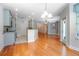 Open-concept living room with hardwood floors, crown molding, and neutral color palette at 215 Coleton Ln, Deland, FL 32724