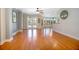 Bright and airy living room featuring hardwood floors and access to the outdoor patio at 215 Coleton Ln, Deland, FL 32724