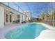 Beautiful backyard pool area featuring screened enclosure and ample patio space at 215 Coleton Ln, Deland, FL 32724