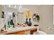 Well-lit bathroom with a spacious vanity, decorative mirrors, and stylish accents, offering a serene atmosphere at 221 Aston Grande Dr, Daytona Beach, FL 32124