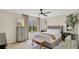Bright bedroom featuring a large window, comfortable bed, side tables, and stylish décor, perfect for relaxation at 221 Aston Grande Dr, Daytona Beach, FL 32124