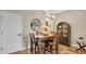 Dining area with modern lighting, dining table set for four, and stylish accents at 221 Aston Grande Dr, Daytona Beach, FL 32124