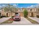 Charming townhouse with brick driveway, one car garage, and well-maintained landscaping at 221 Aston Grande Dr, Daytona Beach, FL 32124