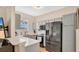 Modern kitchen featuring stainless steel appliances and white countertop with gray cabinets at 221 Aston Grande Dr, Daytona Beach, FL 32124