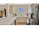 Well-lit kitchen featuring modern appliances, stylish countertops, and ample cabinet space at 221 Aston Grande Dr, Daytona Beach, FL 32124