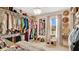 Spacious walk-in closet with ample storage, well-organized racks, and natural light, perfect for wardrobe enthusiasts at 221 Aston Grande Dr, Daytona Beach, FL 32124