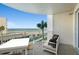 Relaxing oceanfront balcony with comfortable seating and panoramic views of the beach and coastline at 2403 S Atlantic Ave # 209, Daytona Beach Shores, FL 32118