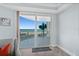 Balcony view overlooking the ocean with seating area and sliding glass doors at 2403 S Atlantic Ave # 209, Daytona Beach Shores, FL 32118