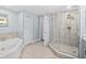 Well-lit bathroom with a shower and a jacuzzi tub, exuding calm and relaxation at 2403 S Atlantic Ave # 209, Daytona Beach Shores, FL 32118