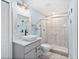 Modern bathroom featuring a glass-enclosed shower, updated fixtures, and bright lighting at 2403 S Atlantic Ave # 209, Daytona Beach Shores, FL 32118