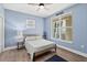 Cozy bedroom with hardwood floors, modern furnishings, and ample natural light at 2403 S Atlantic Ave # 209, Daytona Beach Shores, FL 32118