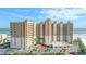 Stunning high-rise beachfront condo building with ocean views, palm trees, and well-maintained landscaping at 2403 S Atlantic Ave # 209, Daytona Beach Shores, FL 32118