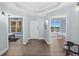 Hallway entrance leading to bedrooms with natural light and ocean views at 2403 S Atlantic Ave # 209, Daytona Beach Shores, FL 32118