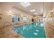 Beautiful indoor pool with lots of natural light, lounge chairs, and a resort-style experience at 2403 S Atlantic Ave # 209, Daytona Beach Shores, FL 32118