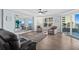 Cozy living room with seating, ocean view, and mirrored wall reflecting the view at 2403 S Atlantic Ave # 209, Daytona Beach Shores, FL 32118