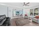 Bright living room featuring a mirrored wall that reflects the ocean view at 2403 S Atlantic Ave # 209, Daytona Beach Shores, FL 32118
