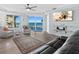 Bright living room with seating area and ocean view from the sliding doors at 2403 S Atlantic Ave # 209, Daytona Beach Shores, FL 32118