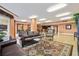 Spacious living room featuring comfortable leather sofas, stylish rug, and elegant decor for a welcoming atmosphere at 2403 S Atlantic Ave # 209, Daytona Beach Shores, FL 32118