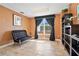 Cozy home office featuring a comfortable seating area, large window, and built-in shelving for a productive workspace at 2403 S Atlantic Ave # 209, Daytona Beach Shores, FL 32118