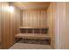 Relaxing wooden sauna with bench seating, providing a tranquil retreat for residents to unwind and rejuvenate at 2403 S Atlantic Ave # 209, Daytona Beach Shores, FL 32118