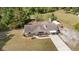 Aerial view of the property highlighting the house, long driveway, and a storage shed at 2485 Se 159Th Lane Rd, Summerfield, FL 34491