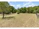 Large backyard with grass and trees at 2485 Se 159Th Lane Rd, Summerfield, FL 34491