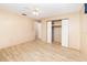 Bedroom features wood-look flooring, a ceiling fan, and a closet with sliding doors at 2485 Se 159Th Lane Rd, Summerfield, FL 34491