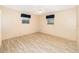 Bedroom featuring wood-look floors, a ceiling fan, two windows, and neutral walls at 2485 Se 159Th Lane Rd, Summerfield, FL 34491