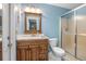 Compact bathroom featuring a shower stall and a wooden vanity at 270 Sandyhook Ln, Deland, FL 32724