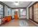 Bright sunroom with windows, ceiling fan, and an exterior door leading to the outside at 270 Sandyhook Ln, Deland, FL 32724