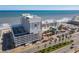 Aerial view of the condo building on the beach, showcasing architecture and street access at 2700 N Atlantic Ave # 801, Daytona Beach, FL 32118