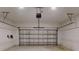 Garage features concrete floors, white walls, and an insulated metal garage door at 28 Guava Ln, Ocklawaha, FL 32179
