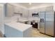 Modern kitchen boasts stainless steel appliances, ample cabinet space, and quartz countertops at 28 Guava Ln, Ocklawaha, FL 32179