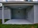 Large, covered patio with ceiling fan, and ample room for entertaining and relaxing at 28 Guava Ln, Ocklawaha, FL 32179