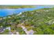 Aerial view of the property with the lake visible behind neighborhood at 2910 Hardy Ave, New Smyrna Beach, FL 32168