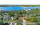 Beautiful aerial view of a home with a large waterfront with mature trees nearby at 2910 Hardy Ave, New Smyrna Beach, FL 32168