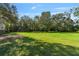 Expansive backyard with a well-maintained lawn and wooden fence at 2910 Hardy Ave, New Smyrna Beach, FL 32168