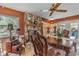Dining room with hardwood floors, a stone fireplace, and elegant wooden furniture at 2910 Hardy Ave, New Smyrna Beach, FL 32168