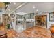 Bright kitchen with modern gray cabinets, stainless steel appliances, and an adjacent dining area at 2910 Hardy Ave, New Smyrna Beach, FL 32168