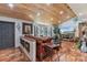 Cozy living room with wood floors, tongue and groove ceiling, bay window and stylish furnishings at 2910 Hardy Ave, New Smyrna Beach, FL 32168