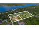 Aerial view of wooded homesite with river views in a desirable neighborhood at 2918 Hardy Ave, New Smyrna Beach, FL 32168