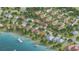 New residential community's aerial view, featuring a waterfront location and charming homes with colorful rooftops at 2918 Hardy Ave, New Smyrna Beach, FL 32168
