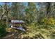 Lush backyard setting with mature trees and boat on trailer at 2918 Hardy Ave, New Smyrna Beach, FL 32168