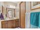 Functional bathroom featuring wood cabinetry, a standard sink, and tile flooring at 2918 Hardy Ave, New Smyrna Beach, FL 32168