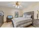 Warm bedroom features carpet, a standard ceiling fan, and a window providing natural light at 2918 Hardy Ave, New Smyrna Beach, FL 32168