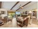 Comfortable living room featuring tile floors, beamed ceilings, and sliding glass doors to the outside at 2918 Hardy Ave, New Smyrna Beach, FL 32168